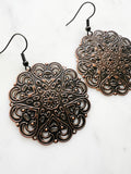 Large Antique Rose Gold Vintage Filigree Mandala Earrings.
Add a touch of whimsy with our Vintage Filigree Earrings. These lightweight beauties feature intricate filigree designs for a boho vibe. Perfect for a playful and carefree look.
Lightweight brass metal stampings with a rose gold patina.
55mm from the top of the ear hook x 44mm