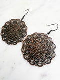 Large Antique Rose Gold Vintage Filigree Mandala Earrings.
Add a touch of whimsy with our Vintage Filigree Earrings. These lightweight beauties feature intricate filigree designs for a boho vibe. Perfect for a playful and carefree look.
Lightweight brass metal stampings with a rose gold patina.
55mm from the top of the ear hook x 44mm