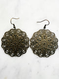 Large Antique Bronze Vintage Filigree Mandala Earrings
Add a touch of whimsy with our Vintage Filigree Earrings. These lightweight beauties feature intricate filigree designs for a boho vibe. Perfect for a playful and carefree look.
Lightweight brass metal stampings with an antique bronze patina.
55mm from the top of the ear hook x 44mm