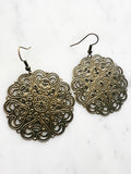 Large Antique Bronze Vintage Filigree Mandala Earrings
Add a touch of whimsy with our Vintage Filigree Earrings. These lightweight beauties feature intricate filigree designs for a boho vibe. Perfect for a playful and carefree look.
Lightweight brass metal stampings with an antique bronze patina.
55mm from the top of the ear hook x 44mm