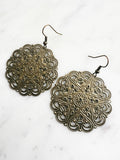 Large Antique Bronze Vintage Filigree Mandala Earrings
Add a touch of whimsy with our Vintage Filigree Earrings. These lightweight beauties feature intricate filigree designs for a boho vibe. Perfect for a playful and carefree look.
Lightweight brass metal stampings with an antique bronze patina.
55mm from the top of the ear hook x 44mm