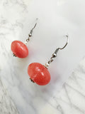 Peach Tourmalinated Quartz Rondelle Earrings on a marble surface