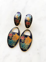 Make your ears purr with delight! These vintage Cloisonne Kitten Earrings add a fun and funky flair to any outfit, purr-fect for jazzing up a casual Friday look. Show off your love of kittens with these unique and stylish earrings!   You get 2 looks with one pair of earrings. It can be worn in 2 different ways, with the kitties on or off.  Gold Plated  52mm x 23mm