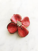 Rustle up some retro flair with this vintage, handmade enamel and crystal brooch! Featuring a unique design that's sure to add sparkle to your 'fit, this cheeky bit of bling is guaranteed to make you stand out in the crowd. Adding a touch of vintage dazzle to any outfit is a cinch with this glamorous pin!  This is a completely handmade product where slight variations & imperfections will occur from one brooch to another.  55mm x 55mm