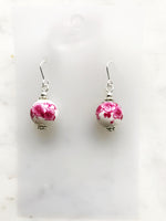 Rock these vintage pink porcelain bead earrings, handmade with care using unique and rare vintage beads. Add a touch of quirkiness to your outfit with these one-of-a-kind earrings. Silver plated 30mm x 12mm