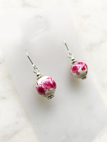 Rock these vintage pink porcelain bead earrings, handmade with care using unique and rare vintage beads. Add a touch of quirkiness to your outfit with these one-of-a-kind earrings. Silver plated 30mm x 12mm