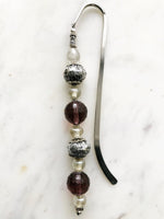 Handmade Bookmark using Vintage Bohemian Glass Beads. These bookmarks are hand made using vintage beads from broken or mismatched necklaces and earrings. Each bookmark is unique and carefully crafted to have a vintage feel and look. 16cm long.