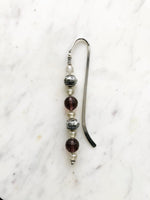 Handmade Bookmark using Vintage Bohemian Glass Beads. These bookmarks are hand made using vintage beads from broken or mismatched necklaces and earrings. Each bookmark is unique and carefully crafted to have a vintage feel and look. 16cm long.