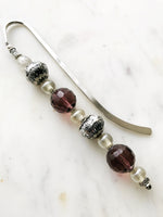 Handmade Bookmark using Vintage Bohemian Glass Beads. These bookmarks are hand made using vintage beads from broken or mismatched necklaces and earrings. Each bookmark is unique and carefully crafted to have a vintage feel and look. 16cm long.