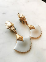 These vintage earrings are sure to put the 'cha' in 'chic'! For the fashion maven who's looking for old-school glamour, these Art Deco Enamel Earrings will add classic elegance to any look. With their timeless design and intricate details, they'll help you make a statement without ever having to say a word!  Clip On Earrings  Gold Plated  62mm x 35mm