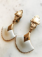 These vintage earrings are sure to put the 'cha' in 'chic'! For the fashion maven who's looking for old-school glamour, these Art Deco Enamel Earrings will add classic elegance to any look. With their timeless design and intricate details, they'll help you make a statement without ever having to say a word!  Clip On Earrings  Gold Plated  62mm x 35mm