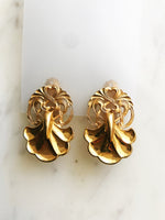 Rock a retro look with these one-of-a-kind Vintage Clip-on Earrings. These beauties are sure to give any outfit a pop of pizzazz. Get ready to bring the funk to any event with this timeless set!  Gold Plated  Clip On   40mm x 25mm