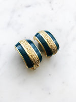 Look super stylish while rocking these vintage retro enamel clip-on earrings! Perfect for adding a bit of 'oomph' to any outfit or occasion. With a hint of playful fun, these earrings are sure to draw attention wherever you go!  Clip On Earrings  Gold Plated  26mm x 15mm