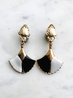 These vintage earrings are sure to put the 'cha' in 'chic'! For the fashion maven who's looking for old-school glamour, these Art Deco Enamel Earrings will add classic elegance to any look. With their timeless design and intricate details, they'll help you make a statement without ever having to say a word!  Clip On Earrings  Gold Plated  62mm x 35mm