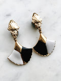 These vintage earrings are sure to put the 'cha' in 'chic'! For the fashion maven who's looking for old-school glamour, these Art Deco Enamel Earrings will add classic elegance to any look. With their timeless design and intricate details, they'll help you make a statement without ever having to say a word!  Clip On Earrings  Gold Plated  62mm x 35mm