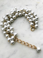 Say bye-bye to boring accessories! This Vintage Glass Pearl Bracelet adds a one-of-a-kind shimmer to your look. Glam up your wrist with this unique piece – there’s no chance you’ll blend into the background.  Vintage Glass Pearls 10mm  One size fits all adjustable bracelet