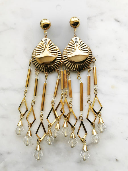 Complete your '80s look with these iconic dangle earrings. From big hair to bright colors, show your appreciation for fashion from the past with this timeless classic. Get ready to rock the night away!  150mm from top of ear hook x 38mm