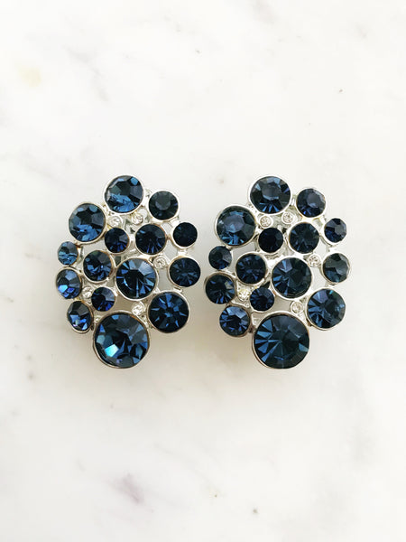 Add a sparkle of vintage glamour with these dazzling sapphire blue clip-on earrings! With plenty of sparkle and shine, these earrings are perfect for adding a touch of old-school class to any outfit!  Vintage Crystal  Silver Plated  Clip on Earrings  36mm x 28mm