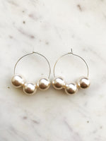 Make a stunning statement with these Vintage Glass Pearl Hoops! These unique and beautiful earrings feature vintage glass pearls, with a subtle shimmer to add a touch of glamour to any look. Handcrafted from broken vintage pearl necklace. Perfect for special occasions or everyday wear. You'll be a vision in these exquisite earrings!  30mm Silver Plated Hoops  10mm Vintage Glass Pearl