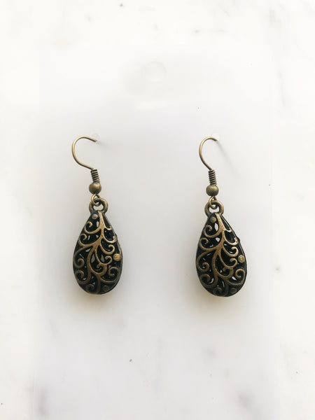 Make a fashion statement with these Antique Bronze Filigree Earrings! The intricate details will add charm and character to any look. Plus, the lightweight design ensures you won’t be weighed down by your baubles! Make like a jewelry box maestro and rock these earrings!  40mm drop from top of ear hook x 12mm