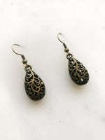 Make a fashion statement with these Antique Bronze Filigree Earrings! The intricate details will add charm and character to any look. Plus, the lightweight design ensures you won’t be weighed down by your baubles! Make like a jewelry box maestro and rock these earrings!  40mm drop from top of ear hook x 12mm