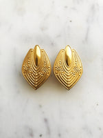 Rock a retro look with these one-of-a-kind Vintage Clip-on Earrings. These beauties are sure to give any outfit a pop of pizzazz. Get ready to bring the funk to any event with this timeless set!