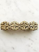 Add a touch of timelessness to your 'do with this classic Vintage Antique Bronze Hair Barrette. This barrette's classic bronze finish is the perfect accessory to take any 'do from meh to marvelous! Spruce up your style in seconds - you'll feel like a dapper dandy in no time!  93mm x 25mm