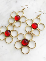 Treat your senses to a flashback of '60s bohemia with these groovy vintage earrings! Featuring fun, vibrant color to make any outfit stand out, these hippie earrings will show off your free-spirited style and make a statement wherever you go. What's more, they're vintage, meaning you'll be rocking with confidence knowing you look good and are doing good for the environment. Peace, love, and flower power!  Red Cabochon Gold Plated 110cmm from top of ear hook x 48mm