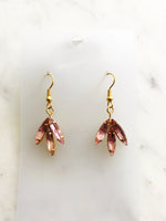 Look classy and vogue in these one-of-a-kind Vintage Navette Crystal Earrings! These earrings are great for adding a hint of sparkle and flair to a night out, making you the belle of the ball. Get ready to twinkle!  Vintage Crystal Earrings  Gold Plated  Nickel free ear hooks for sensitive skin  40mm x 18mm