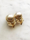 Put your style front and center with these unique vintage Art Deco Dome Pearl Clip-on Earrings! This stunning pair is the perfect addition to any wardrobe giving you a touch of classic elegance with a modern twist. Get ready to shine, clip-on style!  Gold Plated  Clip On   37mm x 21 mm