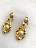 Let your style take the vintage route and sparkle with these delicately poised pearl earrings! Perfect for any occasion, these dreamy, classical earrings will have all eyes on you!  50mm x 20mm