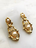 Let your style take the vintage route and sparkle with these delicately poised pearl earrings! Perfect for any occasion, these dreamy, classical earrings will have all eyes on you!  50mm x 20mm