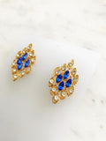 Style up your look with these crystal-studded, vintage retro earrings! With their classic design and glittering adornments, they're the perfect way to add a touch of old-school glam to any outfit. Get ready to shine!  Gold Plated  30mm x 15mm