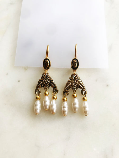 Lovingly crafted from a broken vintage necklace, these earrings combine sleek sophistication with eclectic, bohemian charm, making them the perfect accessory to keep you looking both timeless and stylish.  Gold Plated  45mm x 15mm   