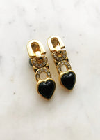 Travel back in time to the golden era of the 50s and 60s - but with a modern twist - with these vintage retro crystal love heart clip on earrings! Perfect for adding a unique and special sparkle to any outfit, these earrings are sure to make a statement! (And don't worry, no pierced ears required!)  Clip-on  Gold plated  42mm x 13mm