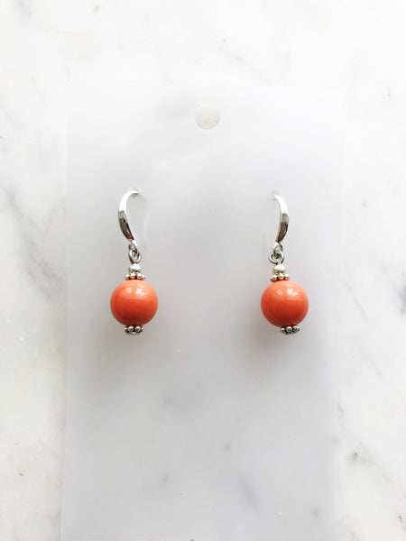 Look dashing and daring in these vintage coral glass pearl earrings. Dazzling yet understated, these are the perfect accessory to take your look to the next level and stand out from the crowd! (Wink!)  Handmade using vintage discontinued coral coloured glass pearls.  Silver plated  35mm x 10mm