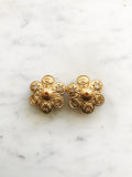 Add a touch of vintage glamour to your look with these playful Golden Stars & Spirals Enamel Clip on Earrings. With their retro design and easy clip-on feature, these earrings will instantly elevate any outfit. Perfect for those who love to make a statement with their style. Clip On Earrings. Gold Plated 40mm x 40mm