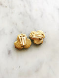 Add some vintage charm to your wardrobe with our Josephine Earrings. These clip-on earrings are a perfect blend of classic elegance and playful nostalgia. Gold Plated 25mm x 25mm