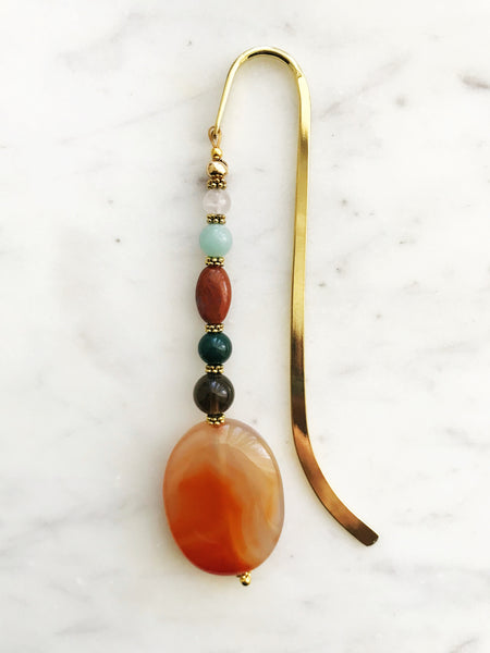 Handmade Bookmark using Semi Precious Crystals   Each bookmark is unique and carefully crafted to have a vintage feel and look. Crystals from top down Rose Quartz Amazonite Jasper Indian Agate Smokey Quartz Agate  13.5cm long