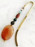 Handmade Bookmark using Semi Precious Crystals   Each bookmark is unique and carefully crafted to have a vintage feel and look. Crystals from top down Rose Quartz Amazonite Jasper Indian Agate Smokey Quartz Agate  13.5cm long