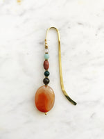 Handmade Bookmark using Semi Precious Crystals   Each bookmark is unique and carefully crafted to have a vintage feel and look. Crystals from top down Rose Quartz Amazonite Jasper Indian Agate Smokey Quartz Agate  13.5cm long