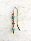 Handmade Bookmark Turquoise Howlite & Carnelian.  Each bookmark is unique and carefully crafted to have a vintage feel and look. Crystals from top down Carnelian Turquoise Howlite Carnelian Carnelian Turquoise Howlite 13cm long