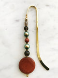 Handmade Bookmark using Semi Precious Crystals & Discontinued Glass Pearl  Each bookmark is unique and carefully crafted to have a vintage feel and look. Crystals from top down, Smokey Quartz, Glass Pearl Goldstone, Glass Pearl, Smokey Quartz,  Goldstone 13.5cm long