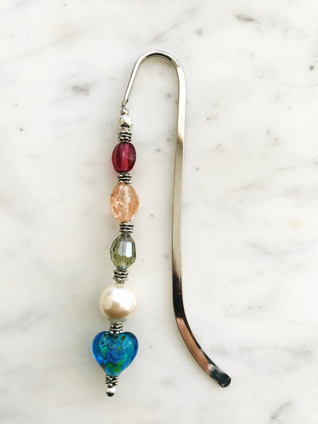 These bookmarks are handmade using vintage beads from broken or mismatched necklaces and earrings. Each bookmark is unique and carefully crafted to have a vintage feel and look. 12.5cm long
