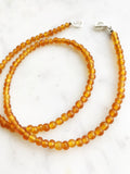 Bohemian Vintage Amber Glass Beaded Necklace Add some vintage charm to your look with this Bohemian Amber Glass Beaded Necklace. Featuring unique amber glass beads, this necklace will add a touch of whimsy to any outfit. Perfect for the free spirit who loves a touch of quirkiness in their fashion. Vintage glass beads 45cm