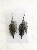 Ready to shoot up the style game? Look exqsuite in these dazzling Gun Metal Leaves Earrings. With a sleek gun metal finish, these earrings will be sure to compliment your outfit. So leave a lasting impression and show off your fashion sense!  70mm x 20mm