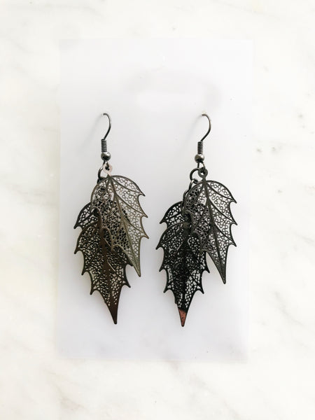 Ready to shoot up the style game? Look exqsuite in these dazzling Gun Metal Leaves Earrings. With a sleek gun metal finish, these earrings will be sure to compliment your outfit. So leave a lasting impression and show off your fashion sense!  70mm x 20mm