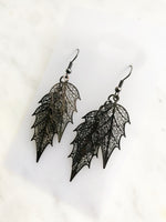 Ready to shoot up the style game? Look exqsuite in these dazzling Gun Metal Leaves Earrings. With a sleek gun metal finish, these earrings will be sure to compliment your outfit. So leave a lasting impression and show off your fashion sense!  70mm x 20mm