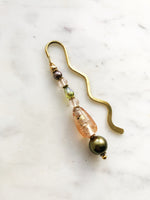 Handmade Bookmark using Vintage Bohemian Glass Beads.  These bookmarks are handmade using vintage beads from broken or mismatched necklaces and earrings.  Each bookmark is unique and carefully crafted to have a vintage feel and look.  9cm long.