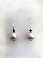 Spice up your earring collection with these quirky handmade Vintage Pink Glass Pearl and black glass bead earrings. Channel retro vibes and unleash your playful side while rocking these unique and stylish accessories. Perfect for adding a touch of fun to any outfit.  Handmade using vintage pink glass pearls and black glass beads.  45mm x 13mm  Nickle free ear hooks for sensitive ears